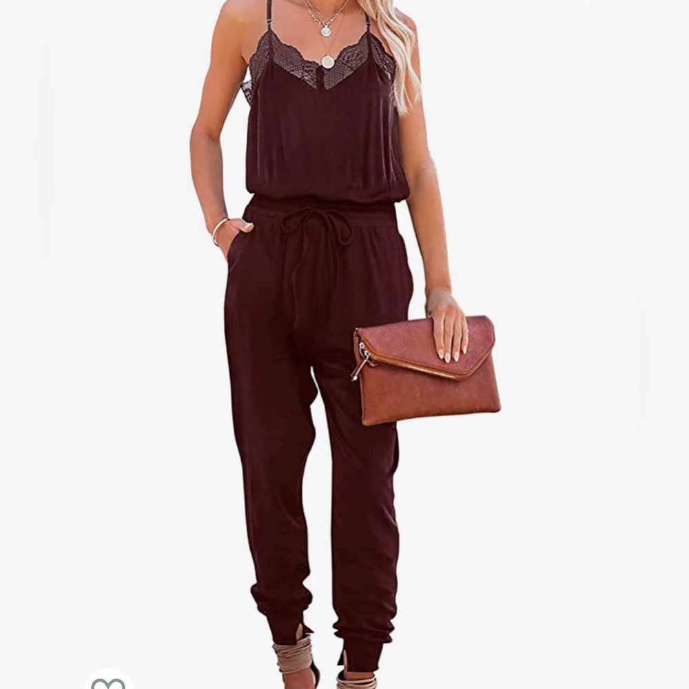 Women’s V-neck sleeveless racer back lace trim romper. Adjustable straps.